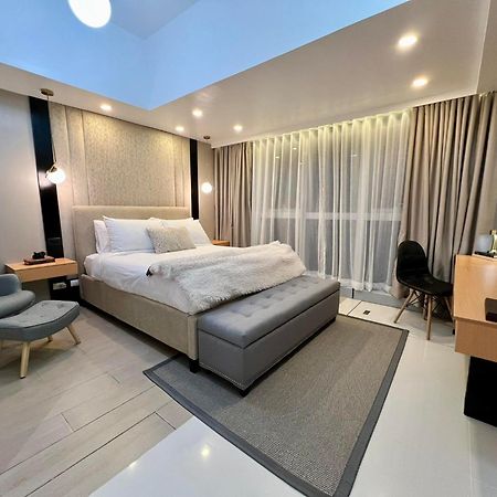 Hotel Vibe Condo At Uptown Parksuites Bgc ตากิก ภายนอก รูปภาพ